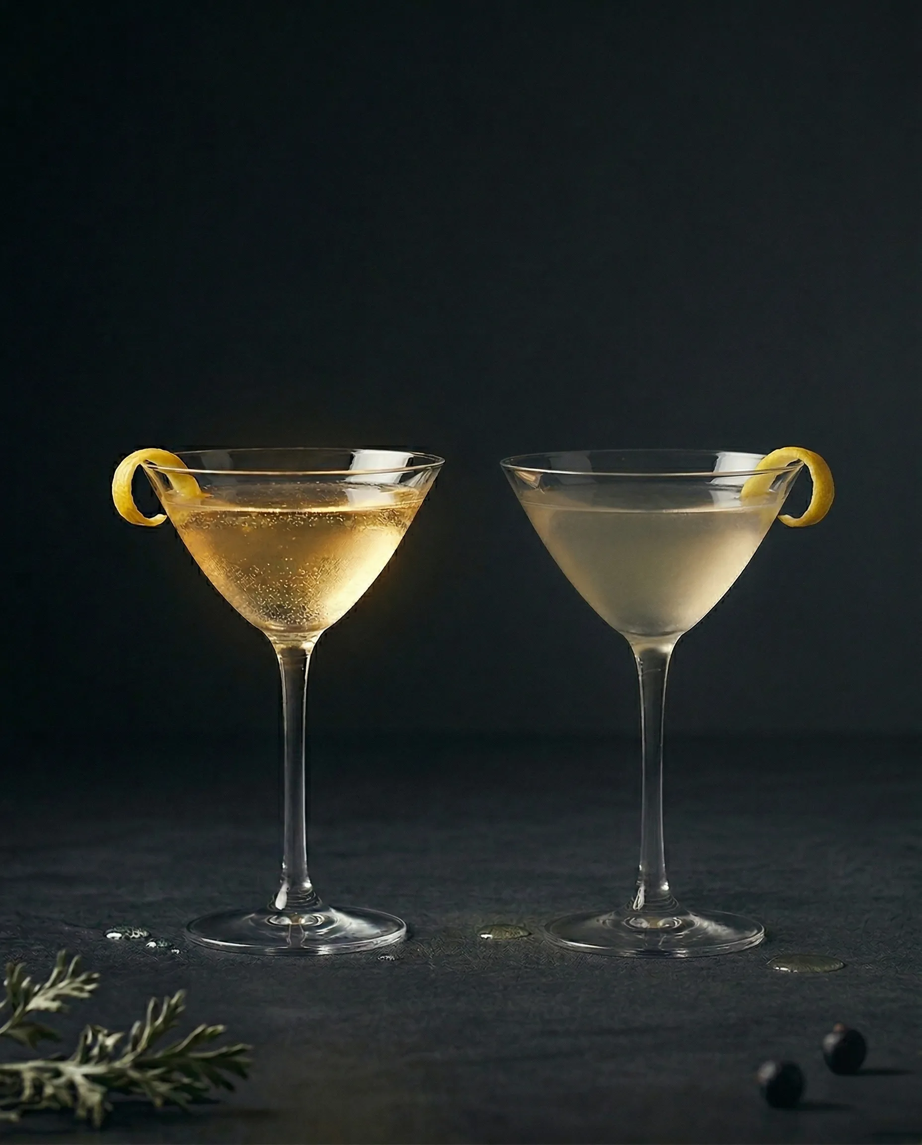 Two Martinis side by side - one made with fresh vermouth, one with old