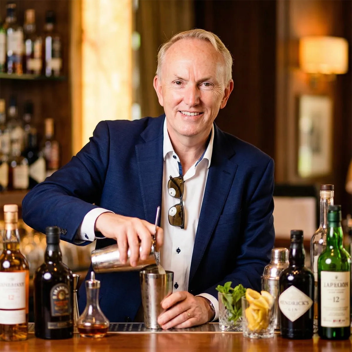 Paul de Hallé making cocktails at his home bar